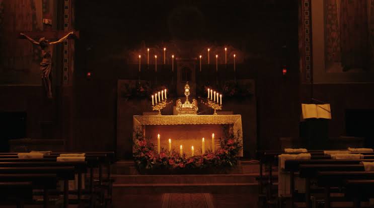 Why do Catholics light candles