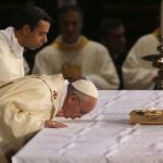 Why Catholic Priests kiss the Altar during the Mass